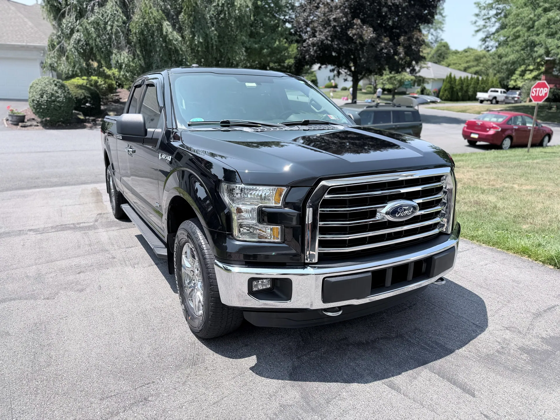 Glossy black Ford F-150 with a protected finish