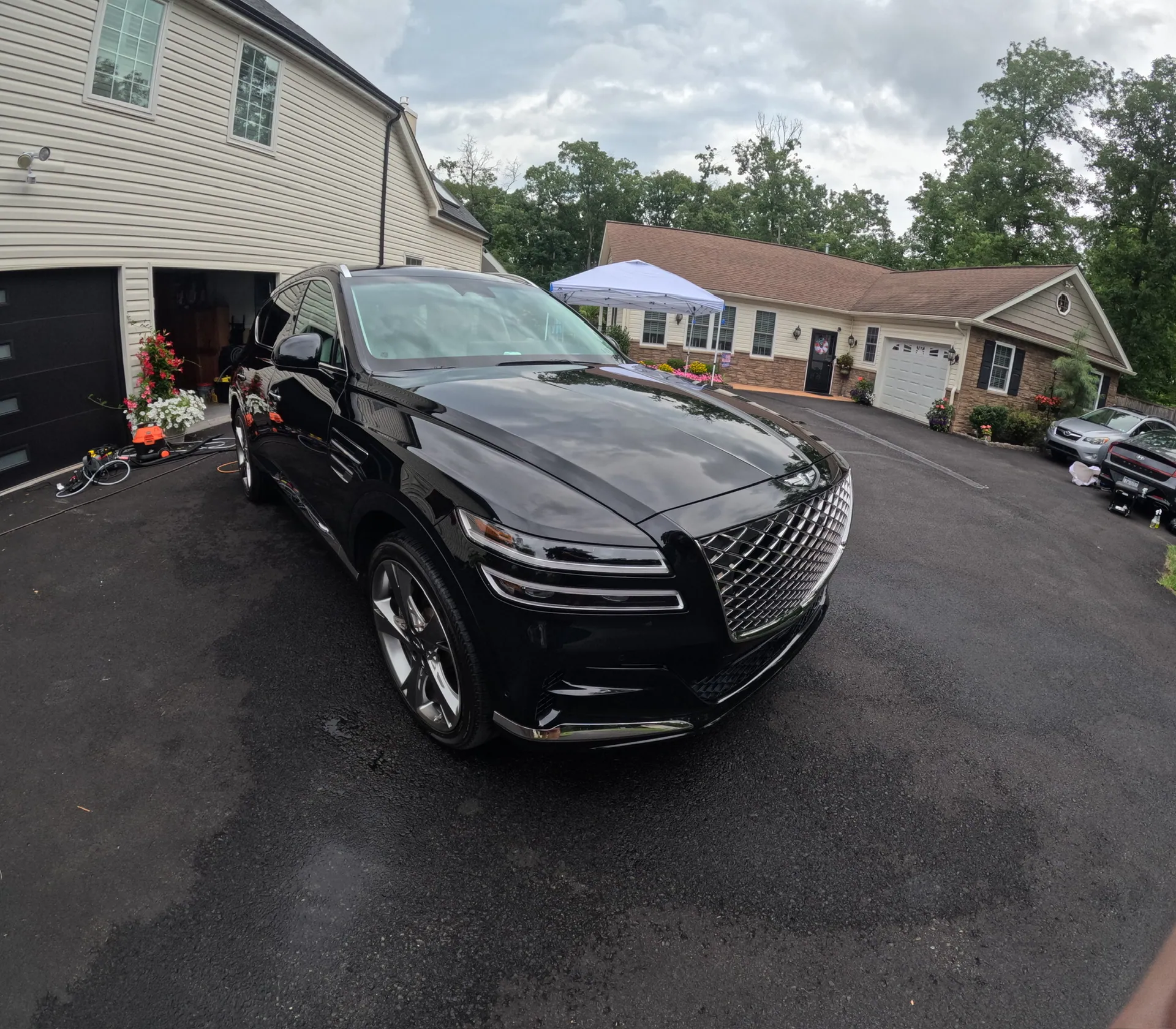 Freshly detailed glossy black Genesis GV80 SUV