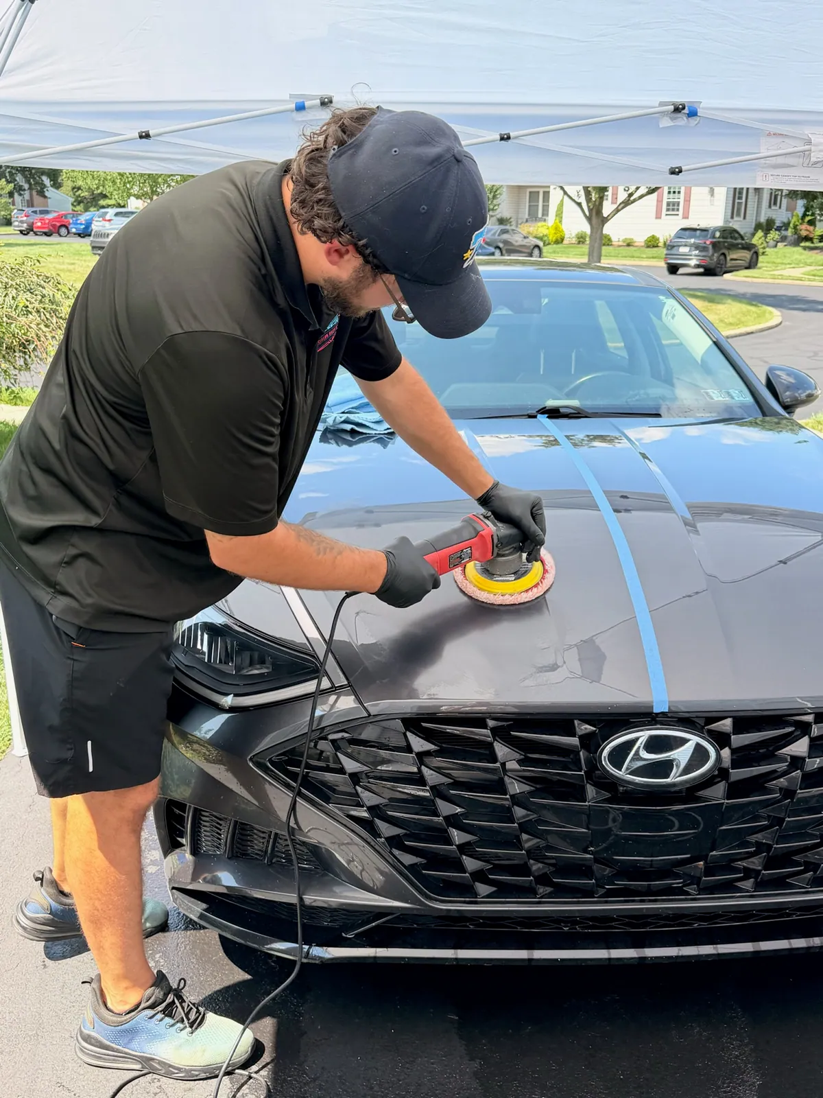 Detailing a vehicle by hand with a polisher