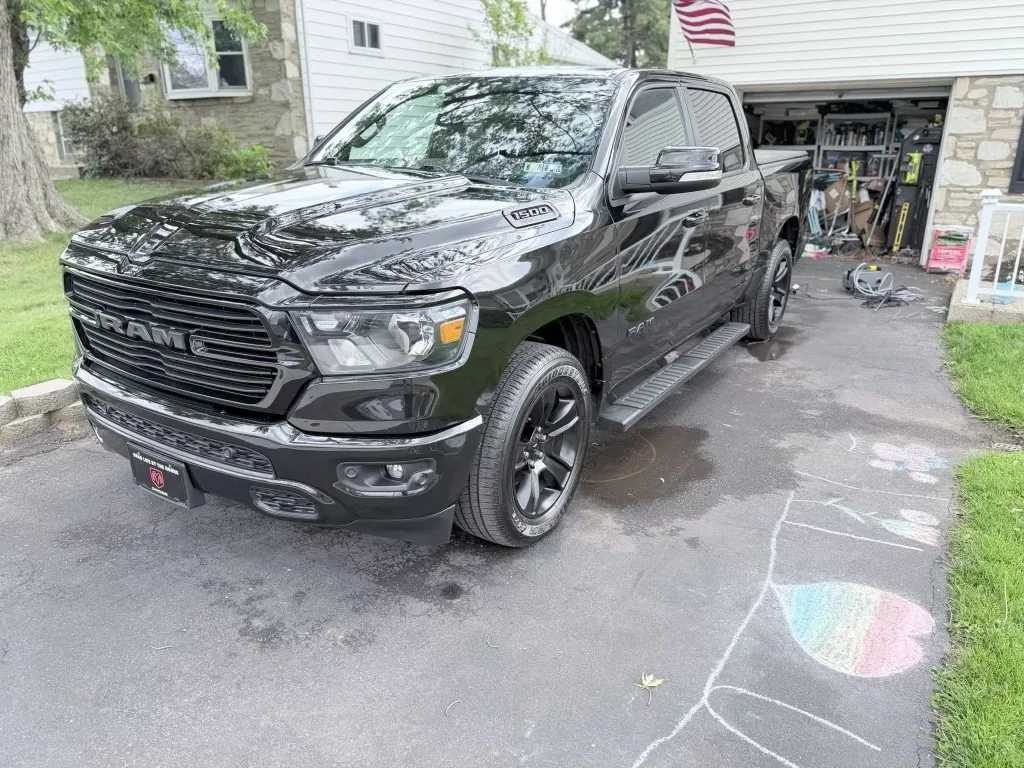 Glossy black Ram 1500 pickup after detailing